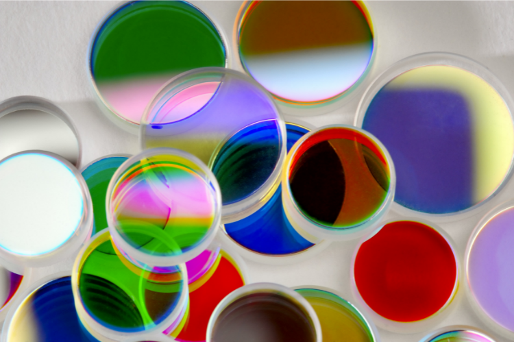 Colourful optical bandpass filters on a white background